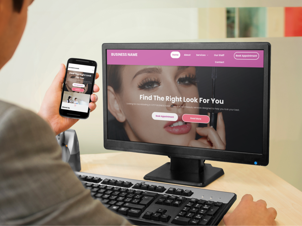 Person holding a phone displaying a website, with the same website open on a computer screen in the background